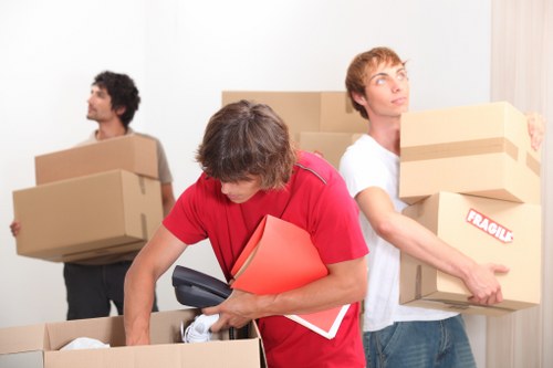 Packed office equipment and furniture ready for relocation
