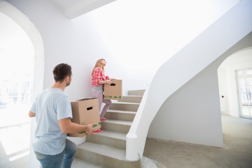 Local removal team transporting office furniture in Croydon