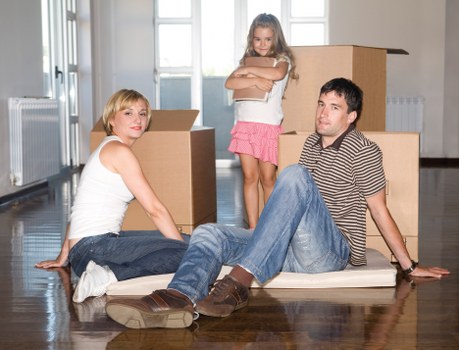 Careful loading of boxes and furniture into moving van
