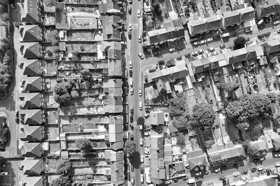A black-and-white aerial photograph of a residential area in Thornton Heath, showing narrow streets lined with terraced houses and detached homes. The image captures a variety of rooftops made of slat