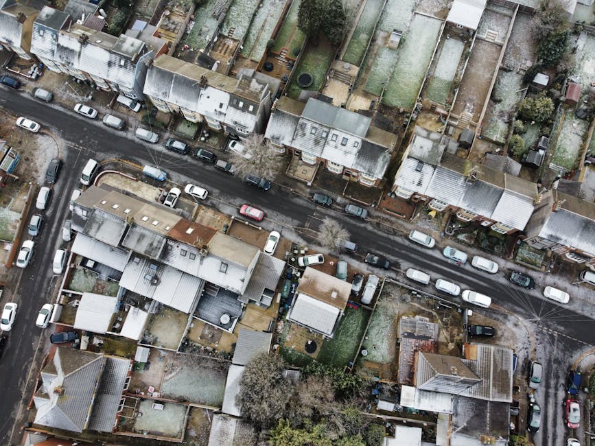 A black-and-white aerial photograph of a residential area in Thornton Heath, showing narrow streets lined with terraced houses and detached homes. The image captures a variety of rooftops made of slat